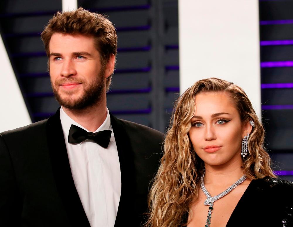 91st Academy Awards – Vanity Fair – Beverly Hills, California, U.S., February 24, 2019 – Liam Hemsworth and Miley Cyrus. REUTERS/Danny Moloshok/File Photo