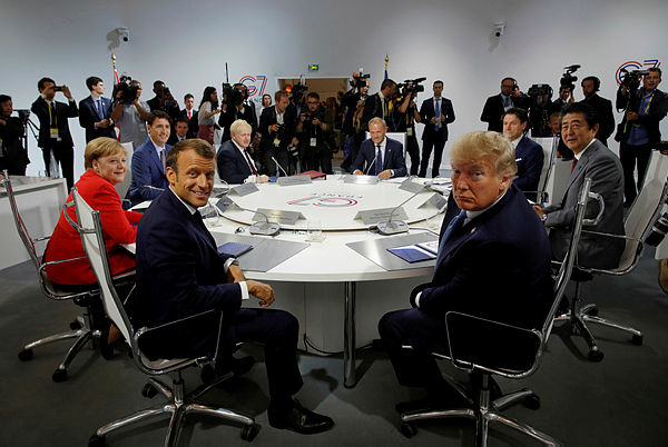 French President Emmanuel Macron, US President Donald Trump, Japan’s Prime Minister Shinzo Abe, Britain’s Prime Minister Boris Johnson, German Chancellor Angela Merkel, Canada’s Prime Minister Justin Trudeau, Italy’s acting Prime Minister Giuseppe Conte and European Council President Donald Tusk attend a G7 working session during the G7 summit in Biarritz, France, Aug 25, 2019. — Reuters