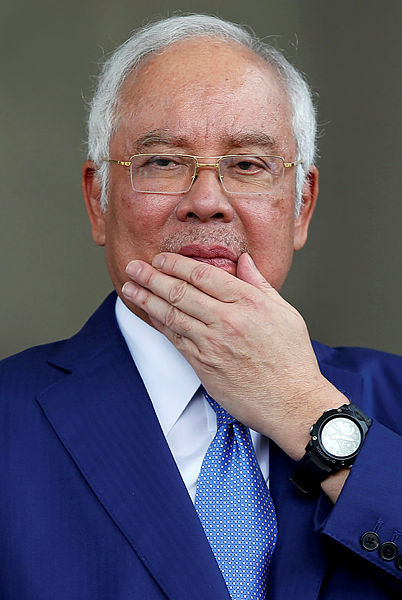 Former prime minister Datuk Seri Najib Abdul Razak leaving Kuala Lumpur High Court yesterday. — Reuters