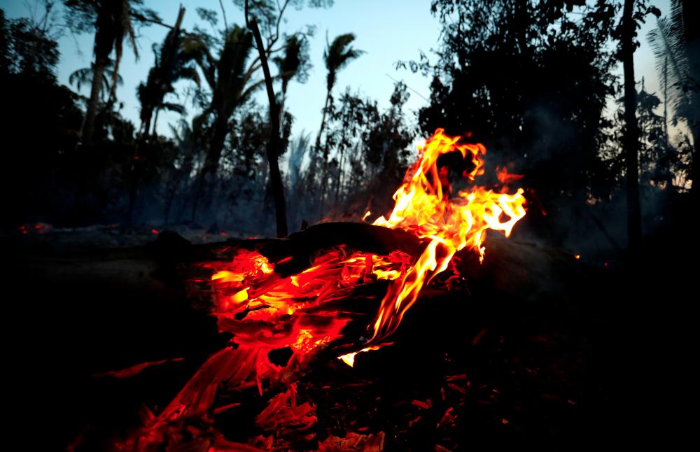 A fire is seen on a tract of Amazon jungle in Itapua do Oeste, Rondonia State, Brazil, September 11, 2019. Picture taken September 11, 2019. — Reuters