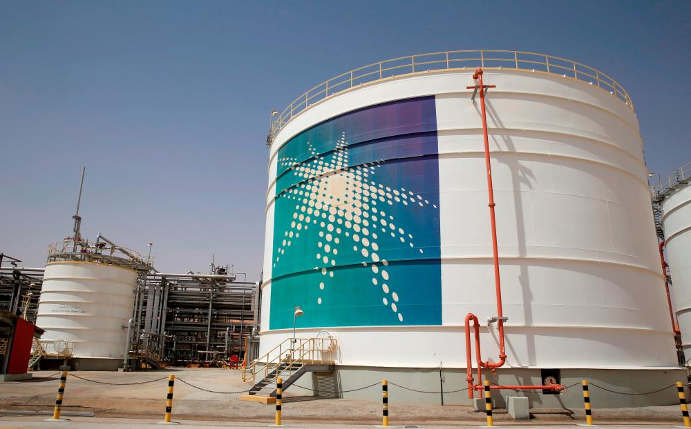 FILE PHOTO: An Aramco oil tank is seen at the production facility at Saudi Aramco's Shaybah oilfield in the Empty Quarter, Saudi Arabia May 22, 2018. REUTERSPIX