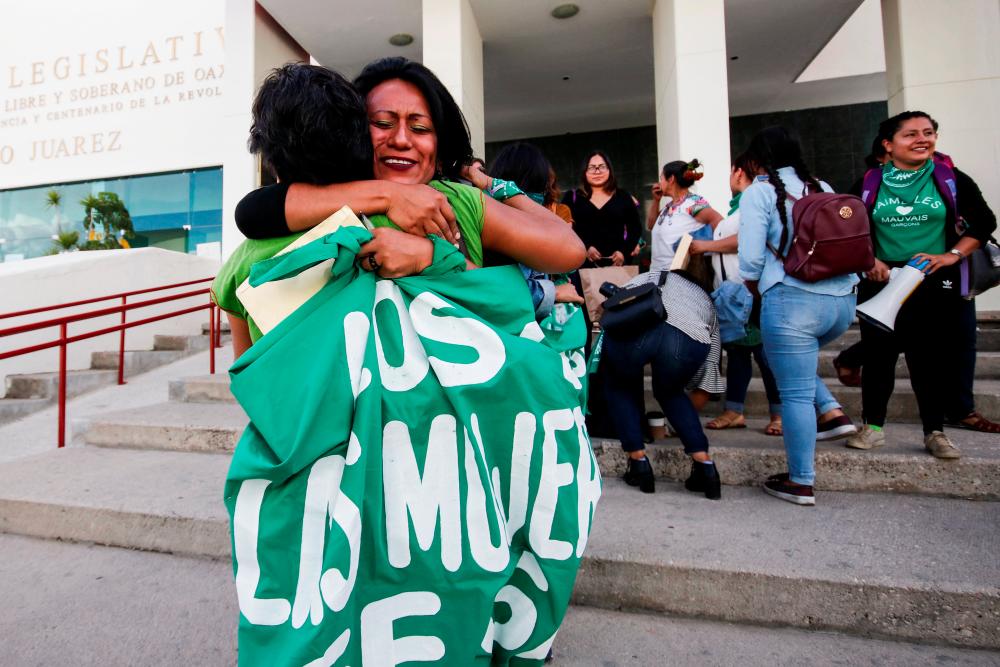 Pro-choice demonstrators celebrate after lawmakers passed a legislation that decriminalizes abortion, outside the local congress in Oaxaca, Mexico Sept 25, 2019. — Reuters