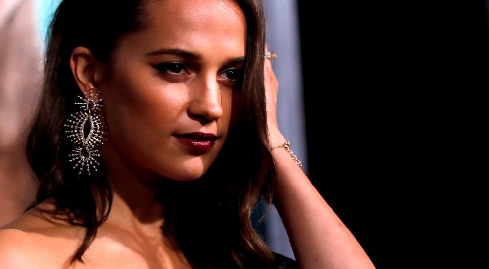 Cast member Alicia Vikander poses at the premiere for “Tomb Raider” in Los Angeles, California, U.S., March 12, 2018. REUTERS/Mario Anzuoni/File Photo