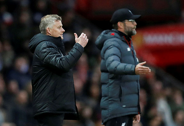 Manchester United manager Ole Gunnar Solskjaer and Liverpool manager Juergen Klopp during the match, October 20, 2019. — Reuters