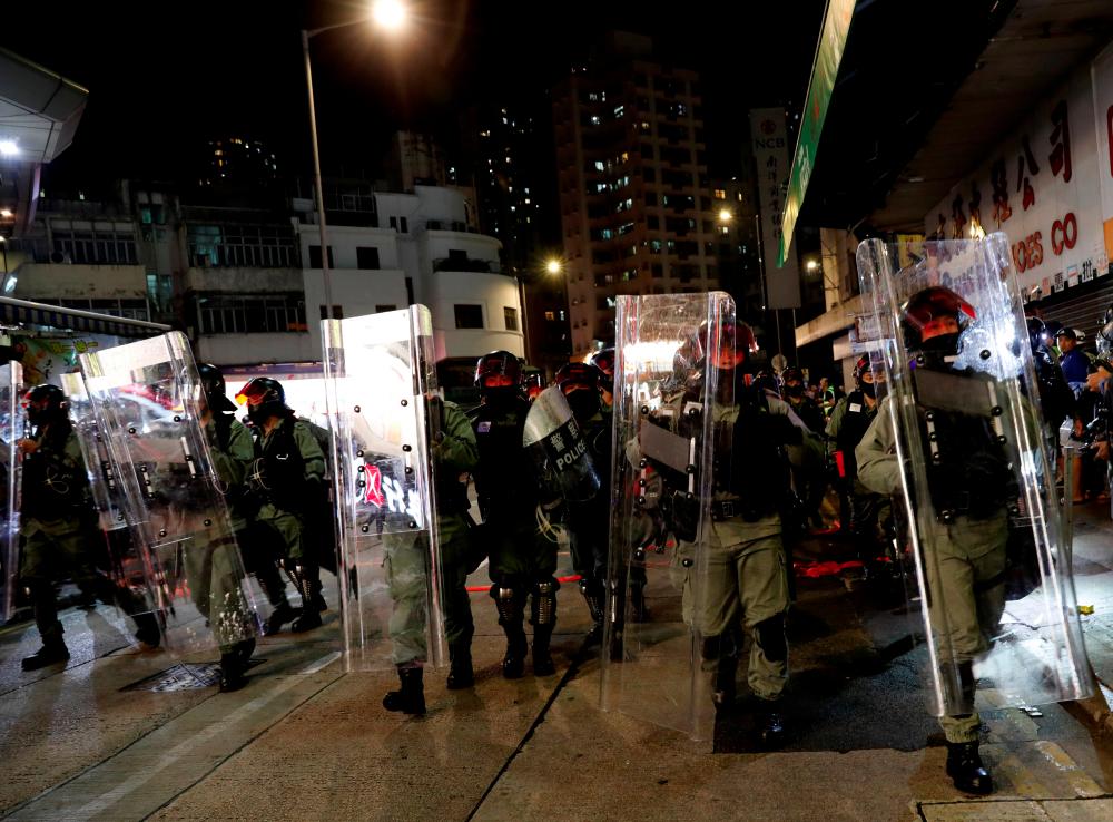 Riot police disperse pro-democracy demonstrators gathering to commemorate the three-month anniversary of an assault by more than 100 men on protesters, commuters and journalists, in Hong Kong, China, Oct 21, 2019. — Reuters