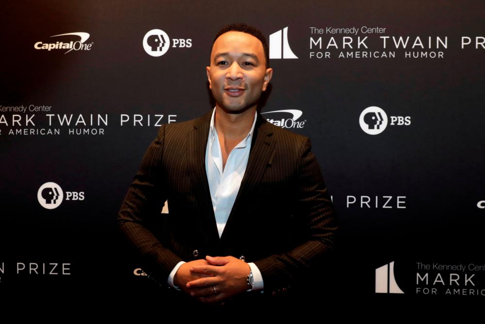 John Legend arrives ahead of comedian Dave Chappelle receiving the Mark Twain Prize for American Humor at the Kennedy Center in Washington, U.S., October 27, 2019. REUTERS/Yuri Gripas/File Photo