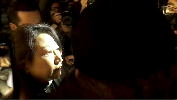 Hong Kong Justice Secretary Teresa Cheng walks as protesters surround her in London, yesterday, in this screengrab obtained via social media. — Reuters