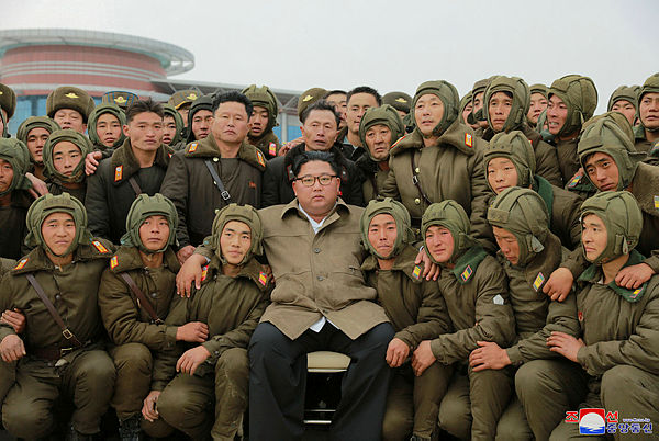 North Korean leader Kim Jong Un poses with sharpshooters of the Air and Anti-Aircraft Force in North Korea, in this undated picture released by North Korea’s Central News Agency (KCNA) on November 17, 2019. — Reuters