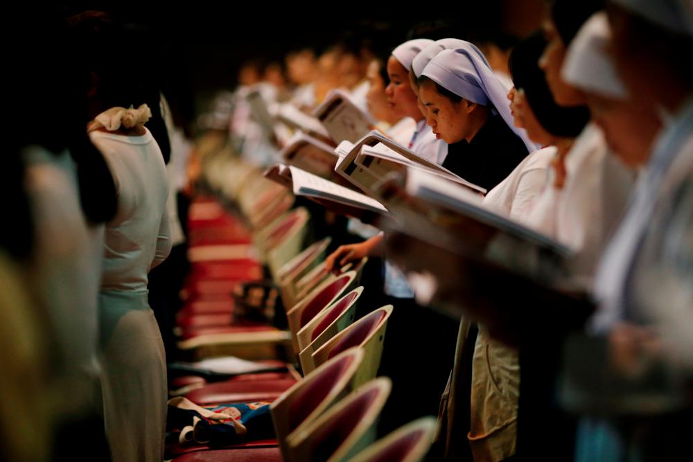Students practice choral singing in a church, ahead of Pope Francis' visit to Thailand, in Bangkok, Thailand on Nov 17. — Reuters