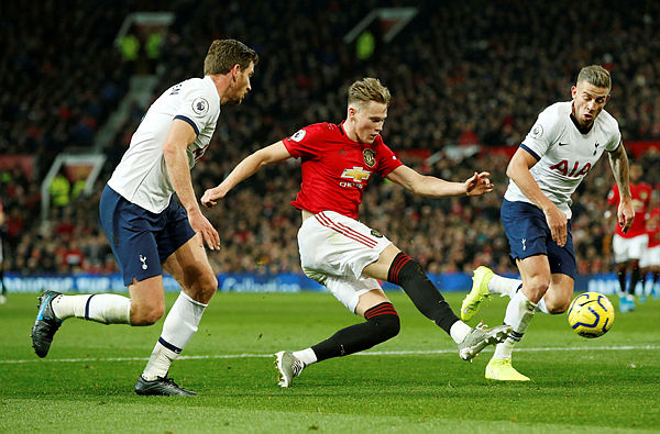 Manchester United’s English midfielder Scott McTominay (C) in action with Tottenham Hotspur’s Toby Alderweireld and Jan Vertonghenduring at the English Premier League football match between Manchester United and Tottenham Hotspur at Old Trafford, Manchester, Dec 4. — Reuters