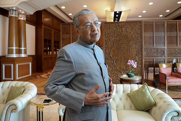 Prime Minister Tun Dr Mahathir Mohamad reacts during an interview with Reuters in Putrajaya, Malaysia, Dec 10, 2019 — Reuters
