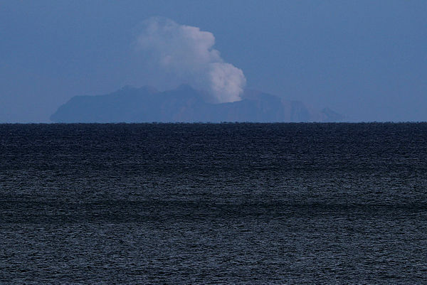 A general view of the Whakaari, also known as White Island volcano, seen from Ohope beach in Whakatane, New Zealand, Dec11. — Reuters