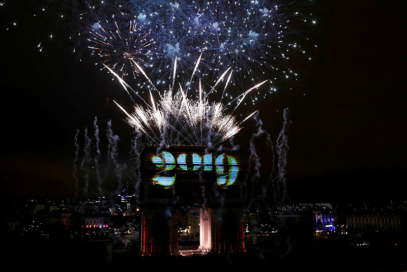 A sound and light show under the theme ‘fraternity’ is seen from the terrace of the Publicis drugstore on the Arc de Triomphe on the Champs-Elysees for New Year’s celebrations in the French capital Paris on Jan 1, 2019 — AFP