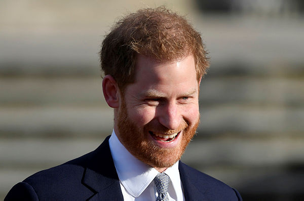 Britain’s Prince Harry smiles during a rugby event at Buckingham Palace gardens in London, Britain January 16. — Reuters