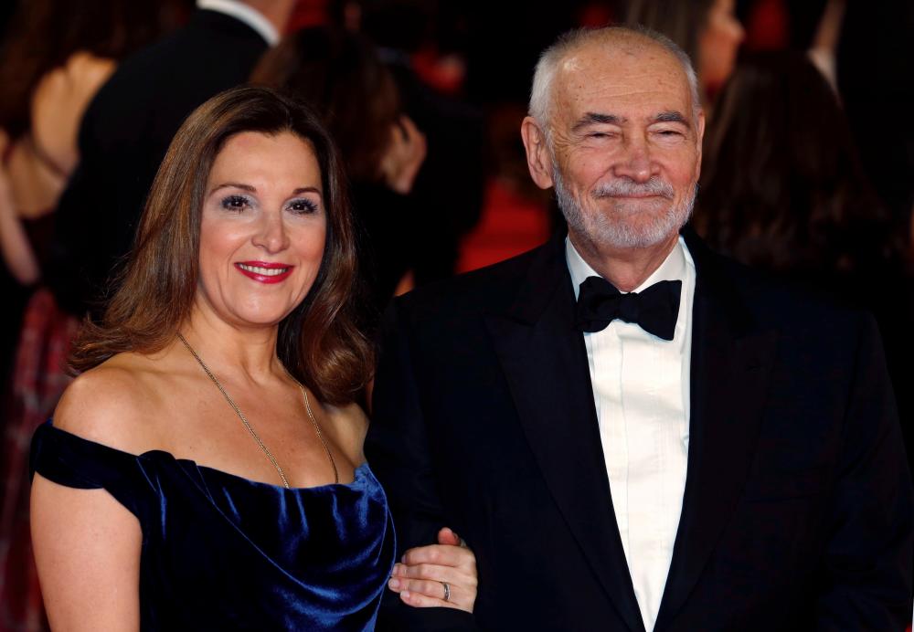 Producers Barbara Broccoli (L) and Michael G. Wilson pose for photographers on the red carpet at the world premiere of the new James Bond 007 film “Spectre” at the Royal Albert Hall in London, Britain, October 26, 2015. REUTERS/Luke MacGregor/File Photo