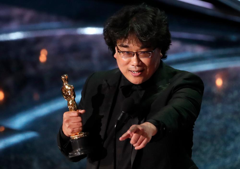 Director Bong Joon-ho accepts the Oscar for Best Foreign Language Film for Parasite of South Korea at the 92nd Academy Awards in Hollywood, Los Angeles, California, U.S., February 9, 2020. REUTERS/Mario Anzuoni