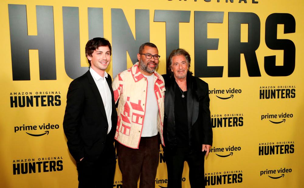 Executive producer Jordan Peele and cast members Logan Lerman and Al Pacino pose at a premiere for the television series “Hunters” in Los Angeles, California, U.S., February 19, 2020. REUTERS/Mario Anzuoni