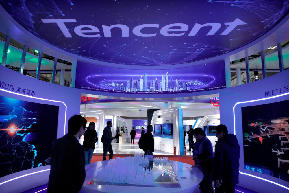 People visit Tencent’s booth at the World 5G Exhibition in Beijing, China November 22, 2019. REUTERS/Jason Lee/File Photo
