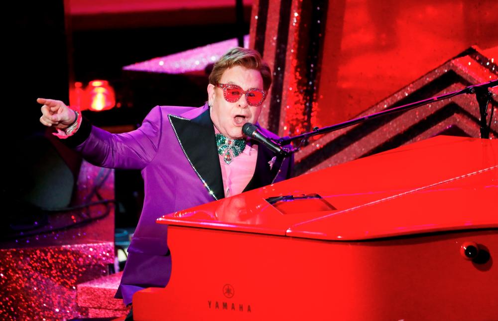 Elton John performs “(I’m Gonna) Love Me Again” from “Rocketman” during the Oscars show at the 92nd Academy Awards in Hollywood, Los Angeles, California, U.S., February 9, 2020. REUTERS/Mario Anzuoni/File Photo