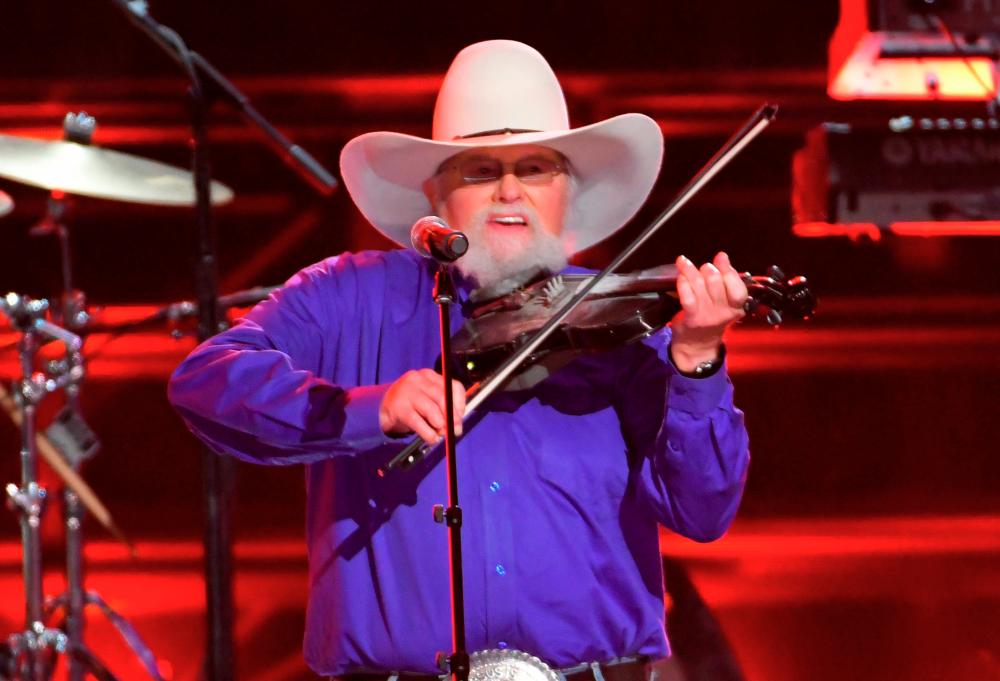 The Charlie Daniels Band performs “The Devil Went Down to Georgia” with Brad Paisley (not pictured) at the 50th Annual Country Music Association Awards in Nashville, Tennessee, U.S., November 2, 2016. REUTERS/Harrison McClary/File Photo