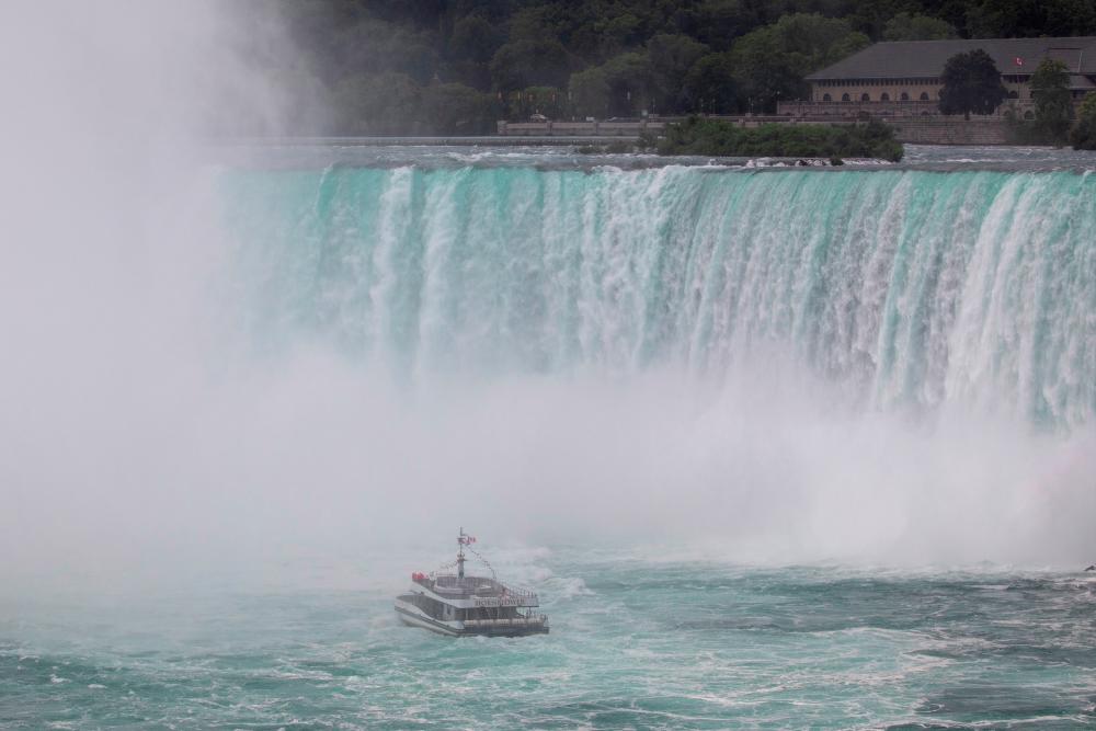 Canadian tourist boat Hornblower, limited under Ontario’s rules to just six passengers amid the spread of the coronavirus disease (COVID-19), is seen in Niagara Falls, Ontario, Canada July 21, 2020. REUTERS/Carlos Osorio