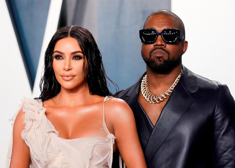 Kim Kardashian and Kanye West attend the Vanity Fair Oscar party in Beverly Hills during the 92nd Academy Awards, in Los Angeles, California, U.S., February 9, 2020. REUTERS/Danny Moloshok/File Photo