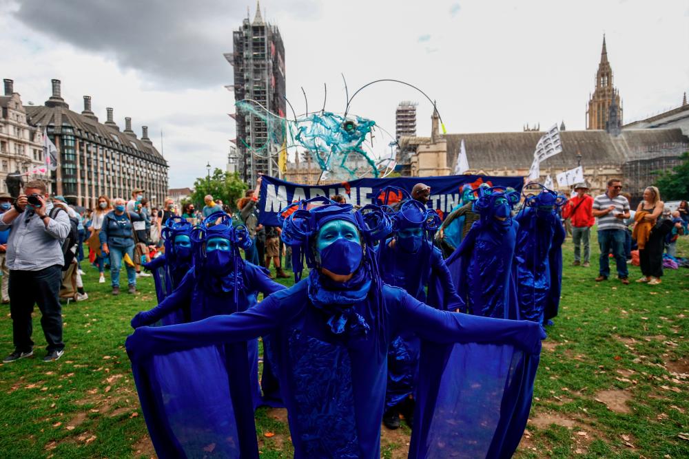 Members of the Ocean Rebellion group attend an Extinction Rebellion protest in London, Britain, September 6, 2020. REUTERS/Henry Nicholls