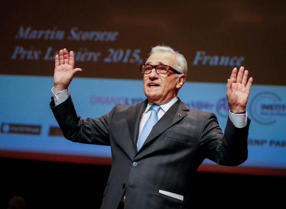 FILE PHOTO: U.S. filmmaker Martin Scorcese waves on stage after being awarded during the 2015 Lumiere Grand Lyon film festival in Lyon, France, October 16, 2015. REUTERS/Robert Pratta/File Photo
