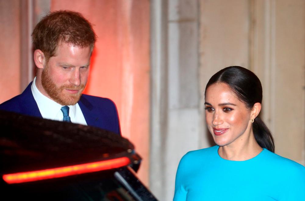 FILE PHOTO: Britain’s Prince Harry and his wife Meghan, Duchess of Sussex, leave after attending the Endeavour Fund Awards in London, Britain March 5, 2020. REUTERS/Hannah McKay/File Photo/File Photo