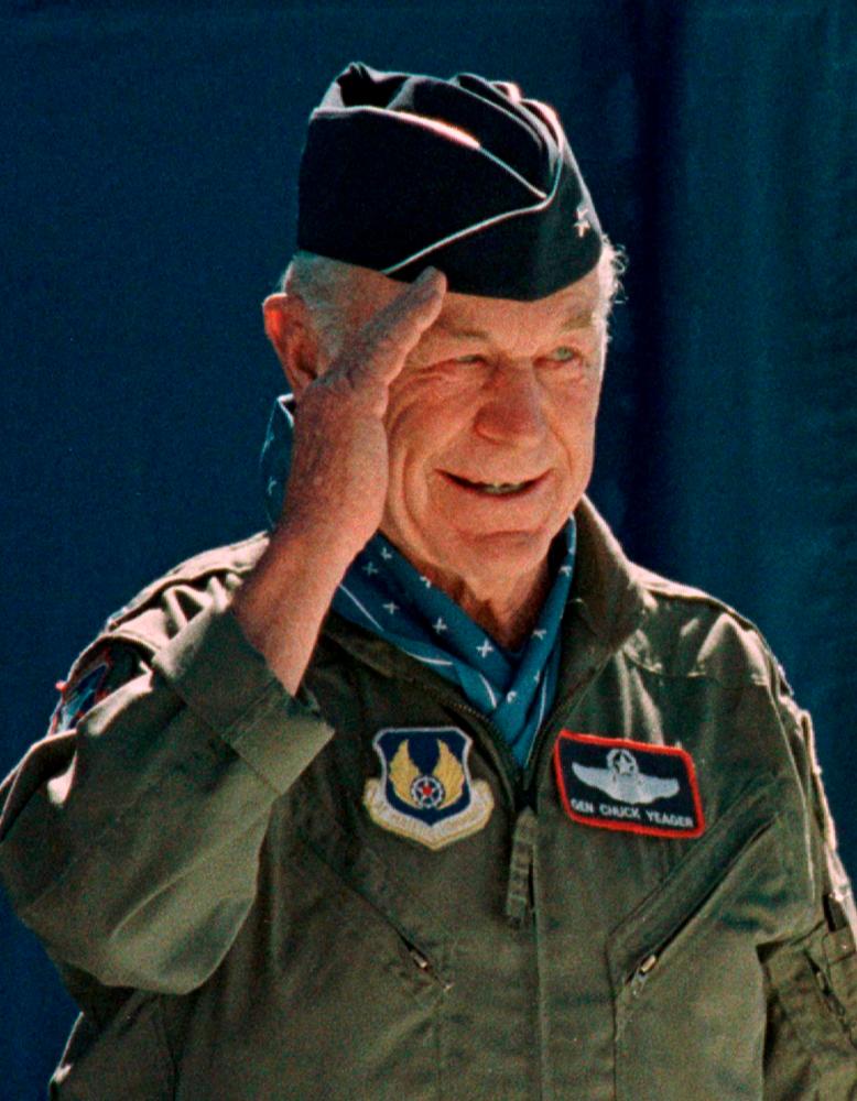 FILE PHOTO: Retired Air Force General Chuck Yeager salutes the crowds gathered at ceremonies honouring the 50th anniversary of his first supersonic flight at Edwards Air Force Base, California, U.S. October 14, 1997. REUTERS/Sam Mircovich/File Photo