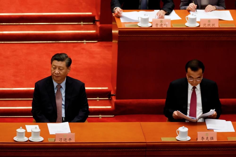 Chinese President Xi Jinping and Premier Li Keqiang attend the opening session of the Chinese People’s Political Consultative Conference (CPPCC) at the Great Hall of the People in Beijing, China March 4, 2021. - Reuters