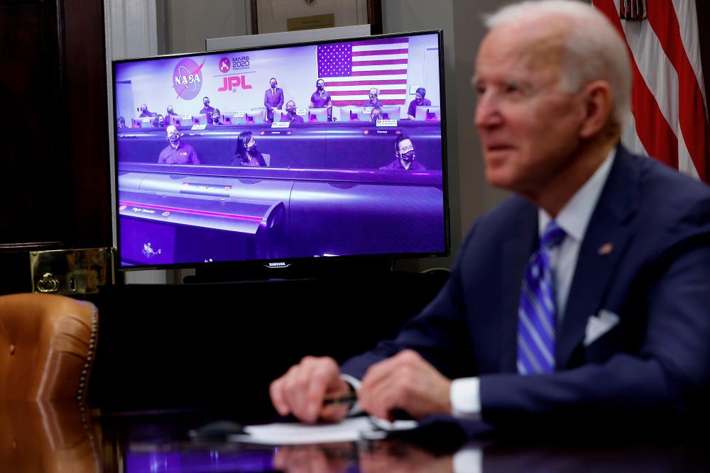 US President Joe Biden participates in a virtual call to congratulate the NASA JPL Perseverance team on the successful Mars landing, inside the Roosevelt Room at the White House in Washington, US, March 4, 2021. - Reuters