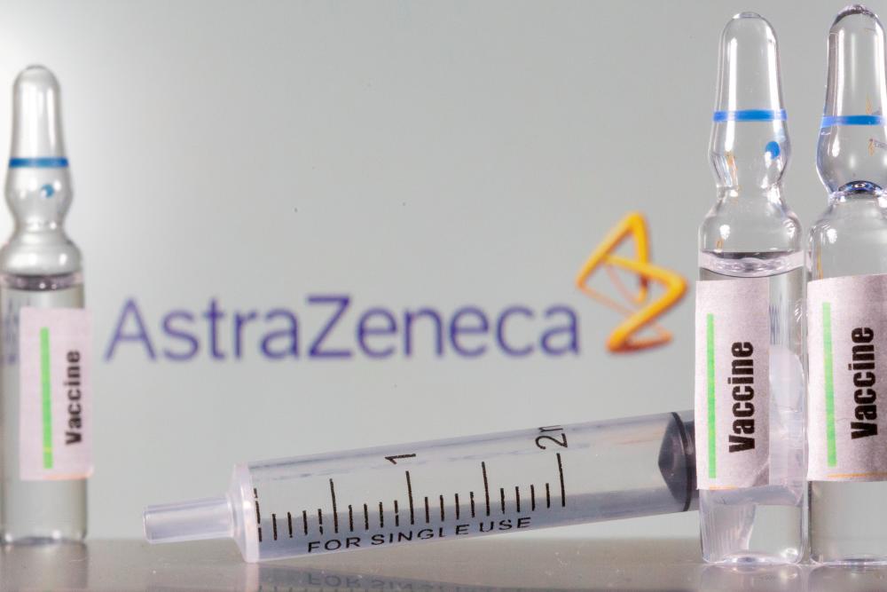FILE PHOTO: A test tube labelled “vaccine” in front of an AstraZeneca logo in this illustration taken, September 9, 2020. - Reuters