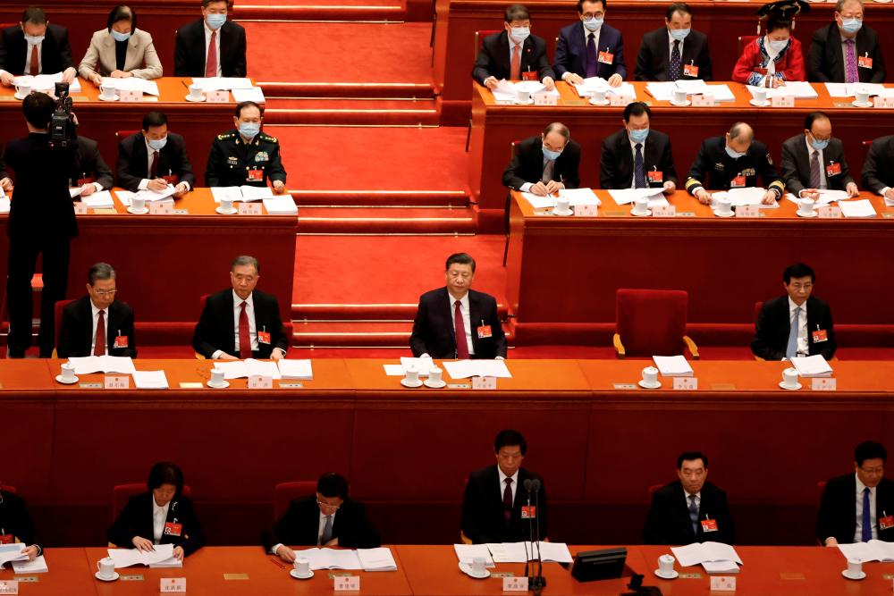 Chinese President Xi Jinping and other leaders attend the opening session of the National People’s Congress (NPC) at the Great Hall of the People in Beijing, China March 5, 2021. - Reuters