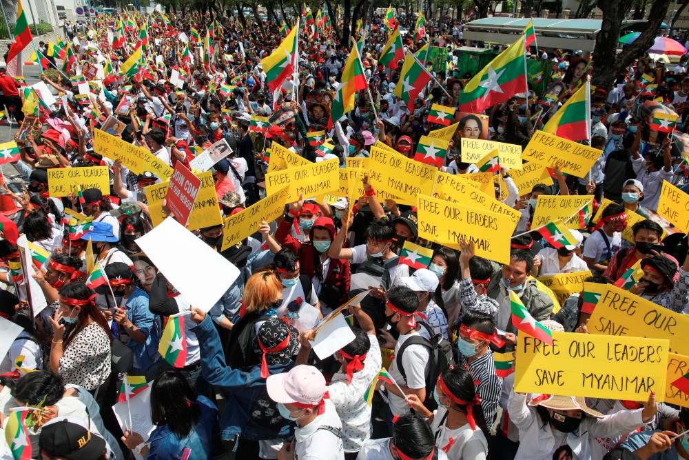 Myanmar citizens living in Thailand protest against Military coup in front of UN office in Bangkok, Thailand, March 7, 2021. - Reuters