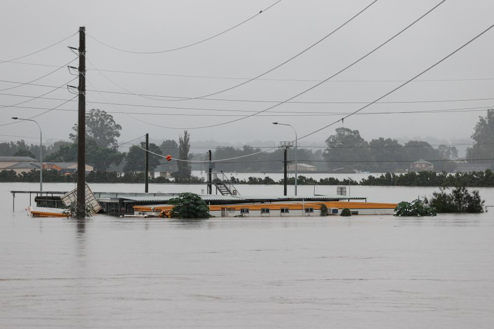 A submerged structure is visible in floodwaters in the suburb of Windsor as the state of New South Wales experiences widespread flooding and severe weather, in Sydney, Australia, March 22, 2021. - Reuters