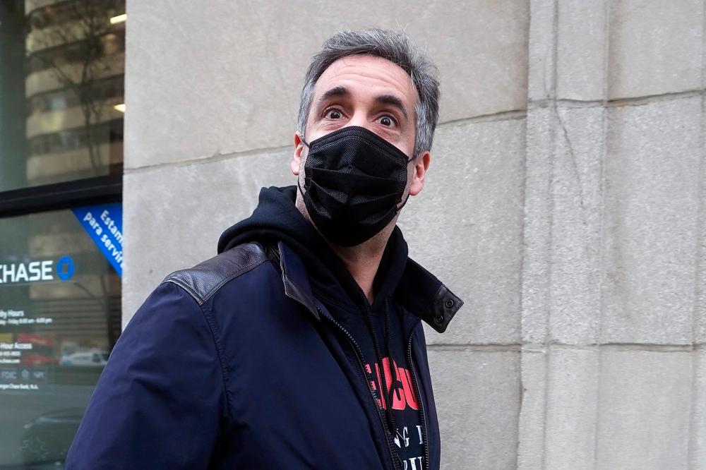 FILE PHOTO: Michael Cohen, former lawyer to former U.S. President Donald Trump, walks out of his apartment in the Manhattan borough of New York City, New York, U.S., March 10, 2021. –Reuters