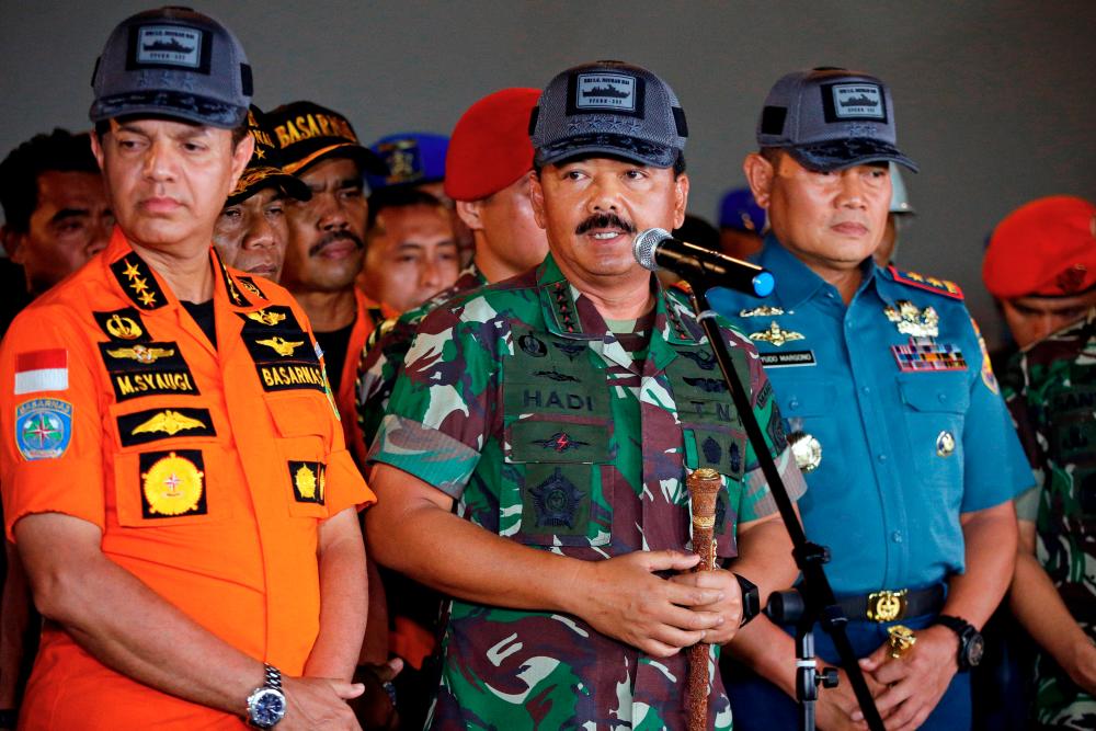 FILE PHOTO: Indonesia’s military chief Hadi Tjahjanto (centre) - Reuters