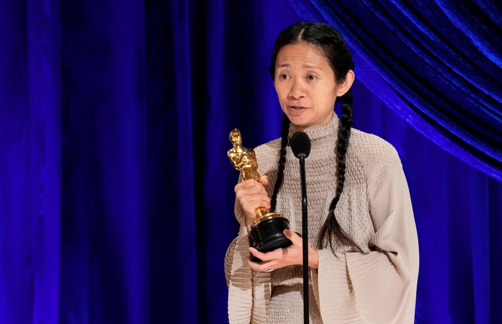 Nomadland director Chloe Zhao accepts the Oscar for Directing during the live ABC Telecast of The 93rd Oscars in Los Angeles, California, U.S., April 25, 2021. - Reuters