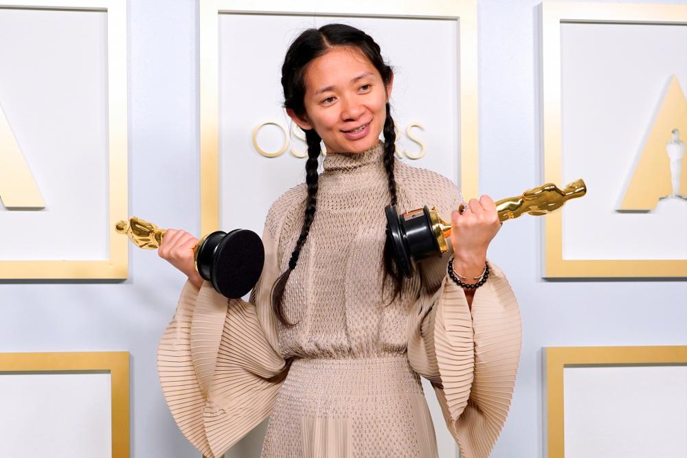 Director/Producer Chloe Zhao, winner of the award for best picture for “Nomadland,“ poses in the press room at the Oscars, in Los Angeles, California, US, April 25, 2021. - Pool via Reuters