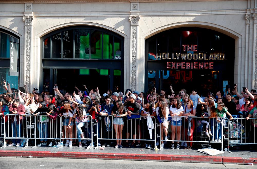 FILE PHOTO: Fans line up along a closed Hollywood Blvd. across from the TCL Chinese Theatre during the World Premiere of Marvel Studios' Spider-man: Far From Home in Los Angeles, California, U.S., June 26, 2019. – Reuters