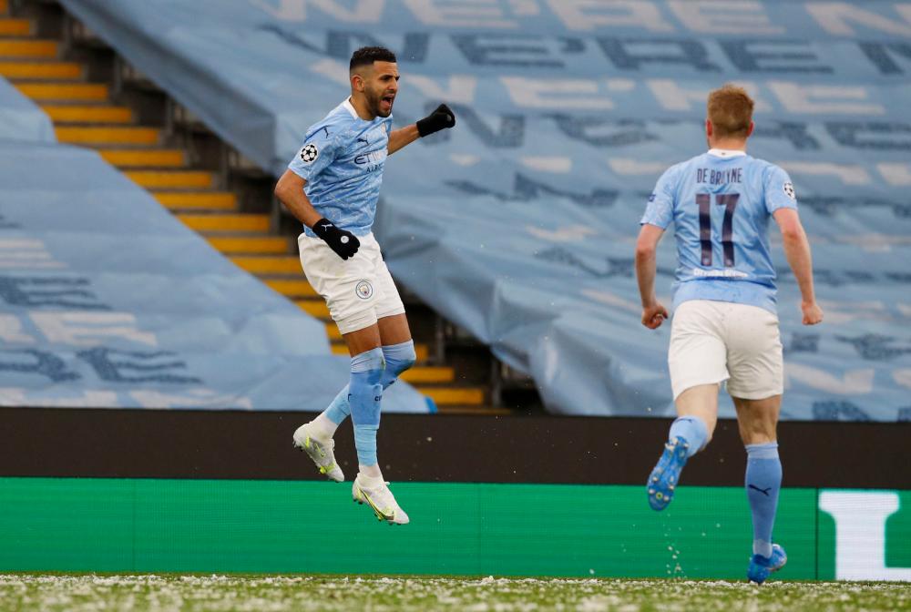 Manchester City's Riyad Mahrez celebrates scoring their first goal with Kevin De Bruyne –Reuters