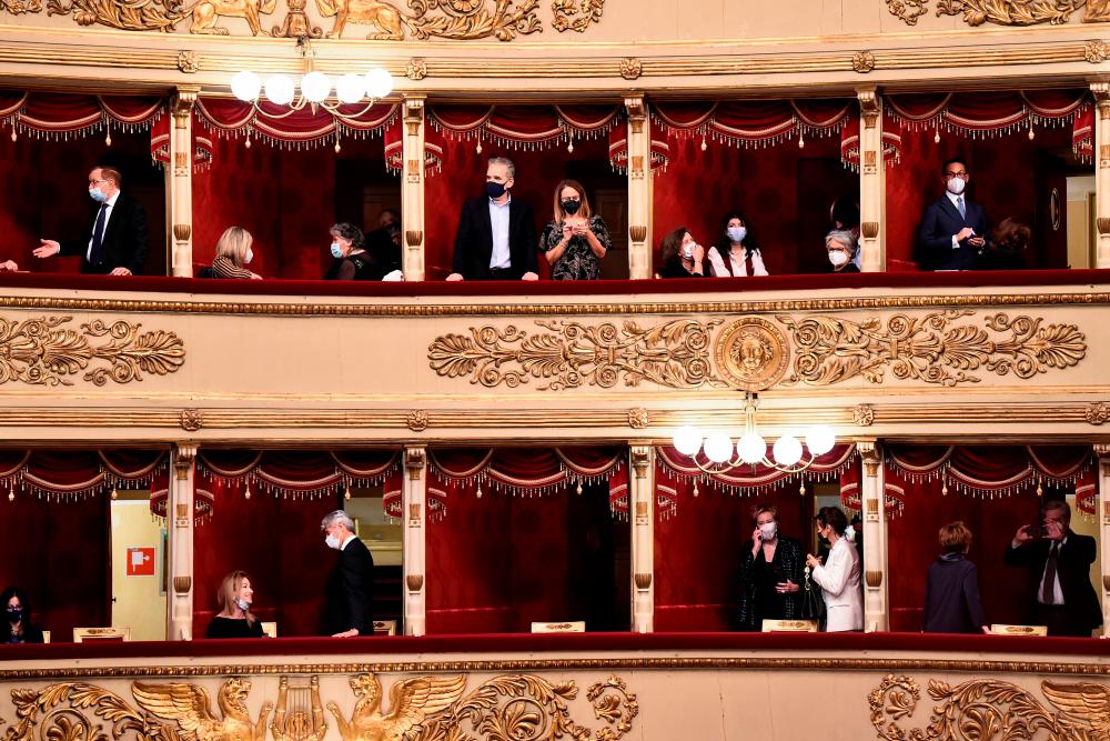 People attend the re-opening of La Scala opera house after it was closed due to the coronavirus disease (COVID-19) pandemic, in Milan, Italy, May 10, 2021. –Reuters