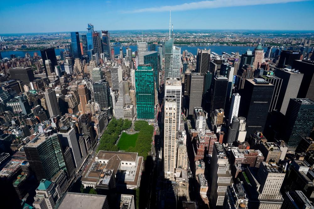 Midtown Manhattan and Bryant Park are pictured from the observation deck of the still under construction One Vanderbilt tower in the Manhattan borough of New York City, New York, U.S., May 11, 2021. Picture taken through a window. –Reuters