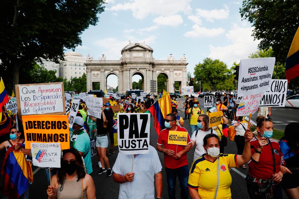 People march in support of the demonstrations taking place in Colombia against President Ivan Duque’s government’s tax reform and police violence, in Madrid, Spain, May 29, 2021. - Reuters
