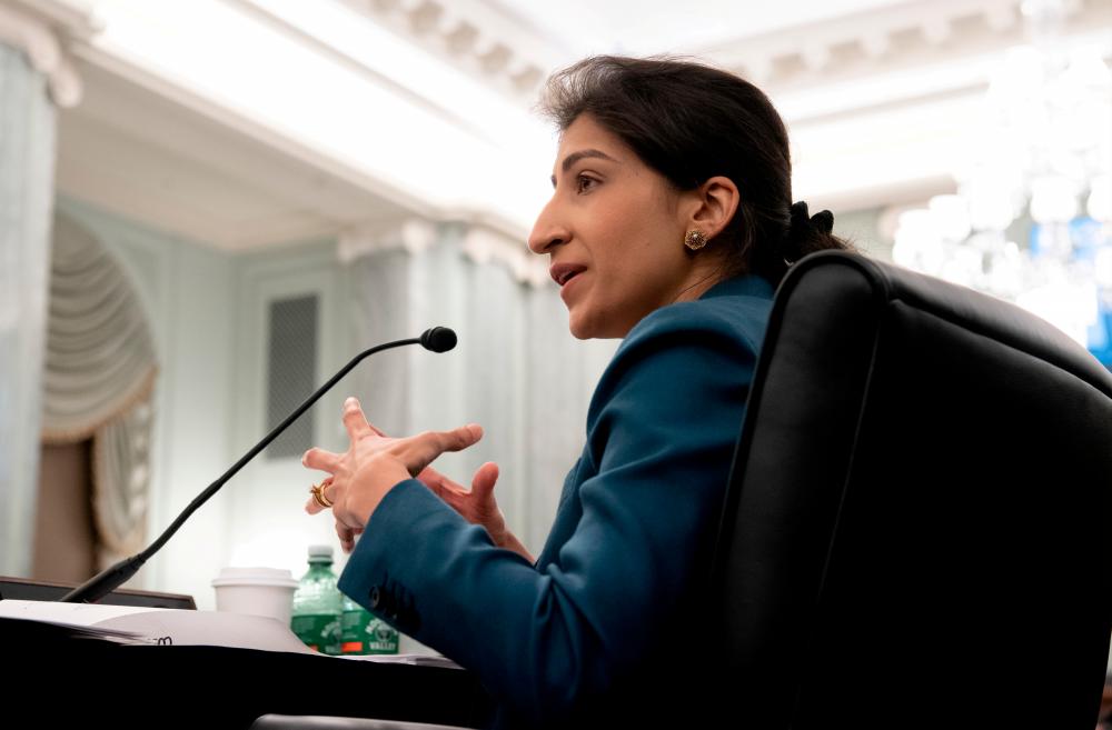 FILE PHOTO: Lina Khan, then-nominee for Commissioner of the Federal Trade Commission (FTC), testifies during a Senate Committee on Commerce, Science, and Transportation confirmation hearing on Capitol Hill in Washington, DC, US April 21, 2021. - Reuters