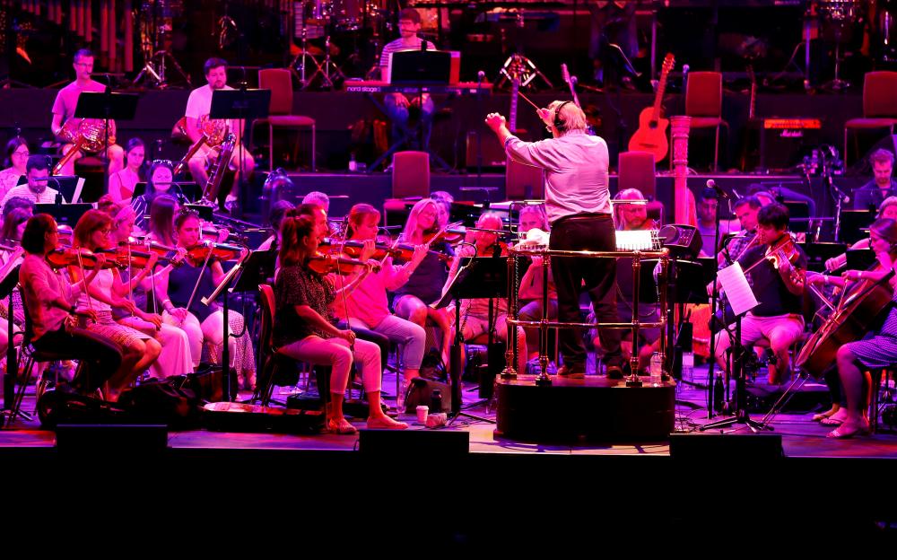 Nicholas Dodd conducts the Albert’s Orchestra during a dress rehearsal of the 150th Anniversary Concert: David Arnold’s ‘A circle of sound’, at the Royal Albert Hall in London, Britain, July 19, 2021. -Reuters