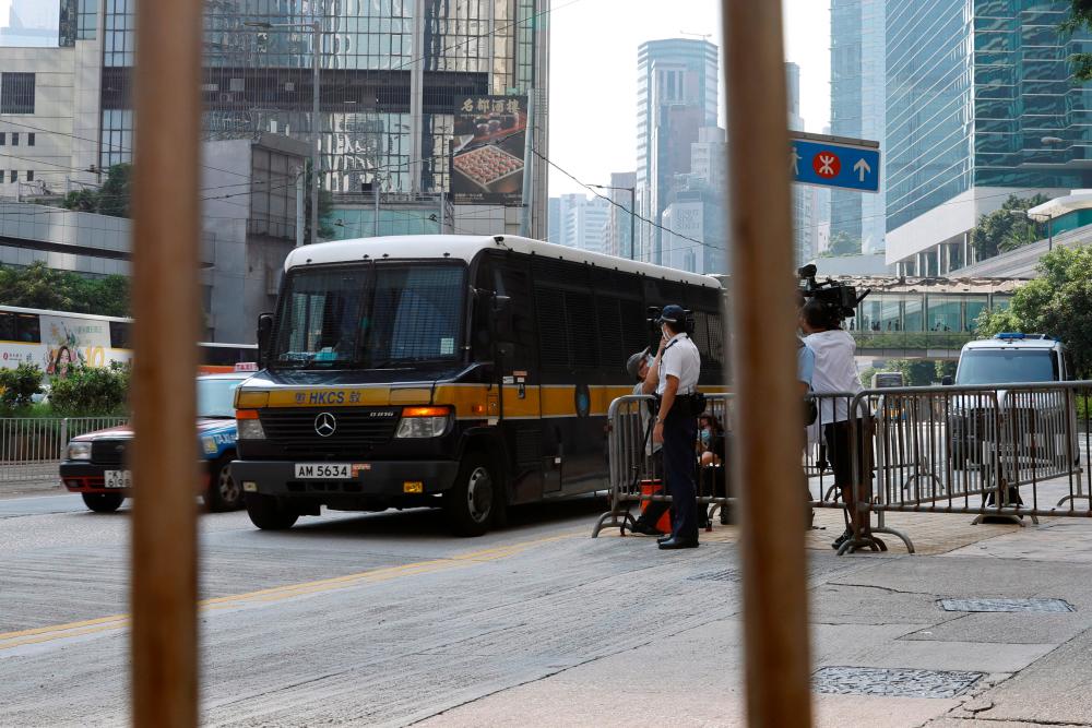 A prison van which is carrying Tong Ying-kit, the first person charged under the new national security law, arrives at High Court for a hearing, in Hong Kong, China July 27, 2021. -Reuters