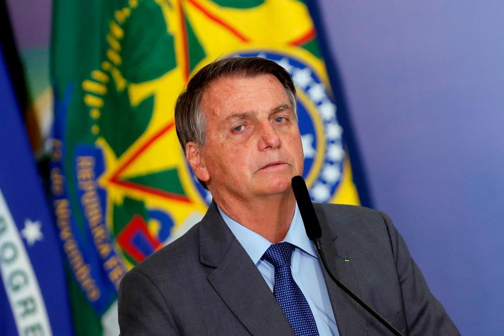FILE PHOTO: Brazil’s President Jair Bolsonaro talks during a ceremony of signing a decree establishing the Public Integrity System of the Federal government at the Planalto Palace in Brasilia, Brazil July 27, 2021. -Reuters