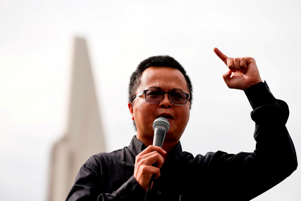 FILE PHOTO: Human rights lawyer Arnon Nampa speaks during a Thai anti-government mass protest, on the 47th anniversary of the 1973 student uprising, in front of the Democracy monument, in Bangkok, Thailand October 14, 2020.-Reuters